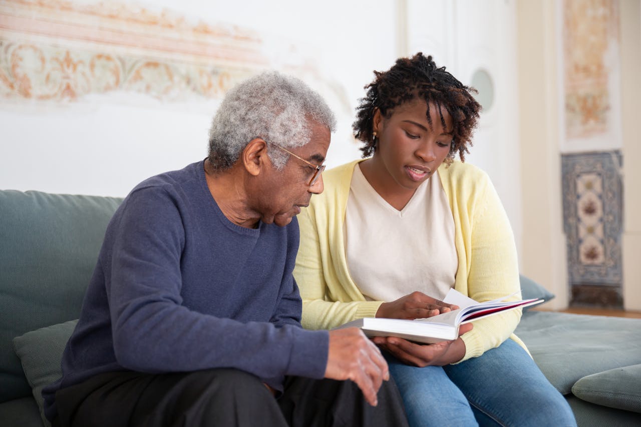 stock image of elderly man and woman reading